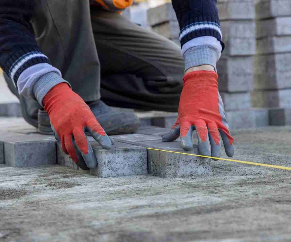 A worker installing pavers in a Las Vegas home.